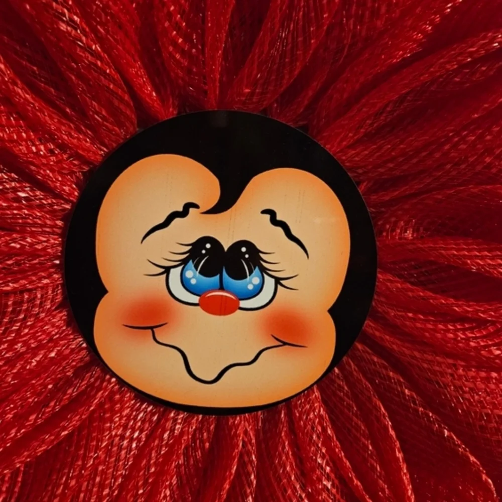 Red Decorative Floral Wreath with Smiling Face Center